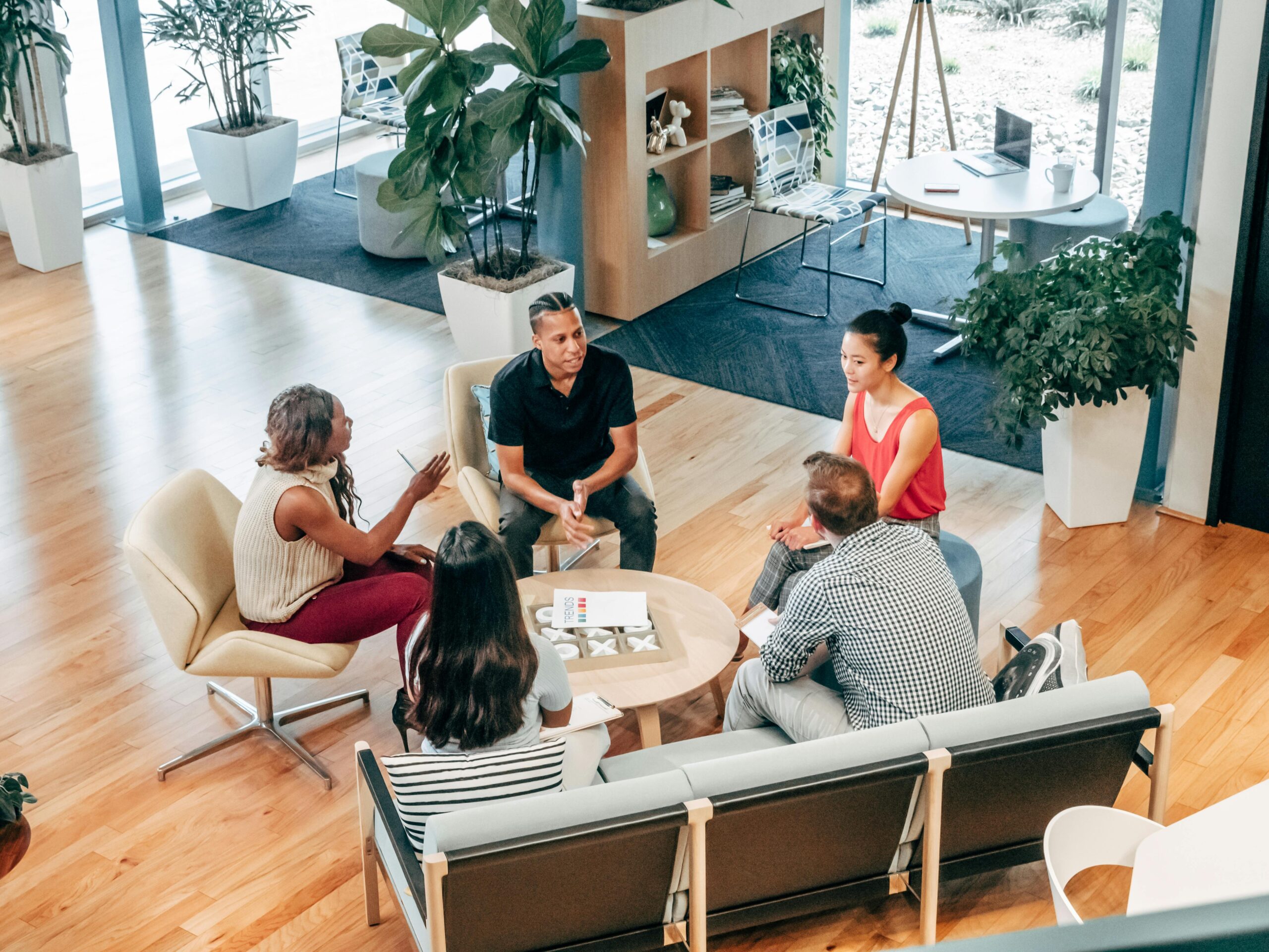 People sitting on a chair while discussing